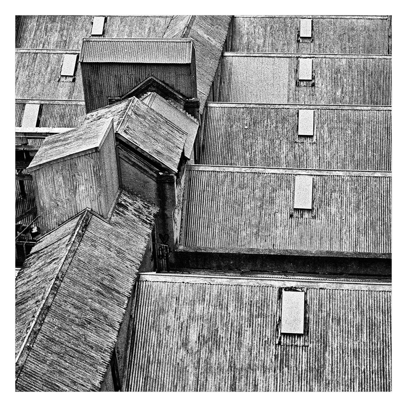 Black and white image of old rooftops from above